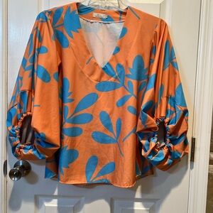Stylish Orange Blouse with Blue Leaf Pattern